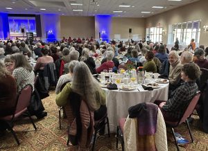 A large hotel ballroom filled with people seated at tables for the 2026 MLK Jr. Breakfast in Asheville